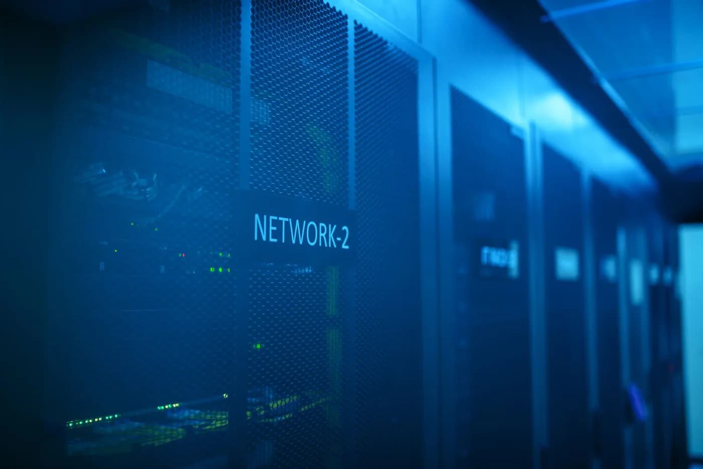 Photograph of network equipment illuminated in blue